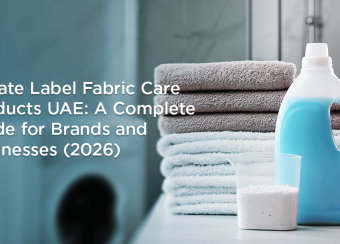 Private label fabric care products UAE with laundry detergent bottles and folded towels